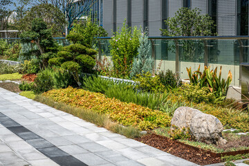 Small planted garden landscaping next to the building