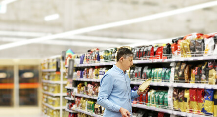 Senior Man Choosing  groceries, vegetables, fruits in the supermarket