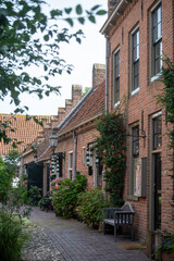 Fototapeta na wymiar Streets and houses of small historical town Buren in Gelderland, Netherlands in sunny day