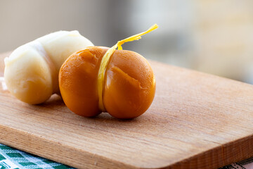 Italian semi hard handmade smoked scamorza cheese, from cow milk from Apulia or Calabria regions...
