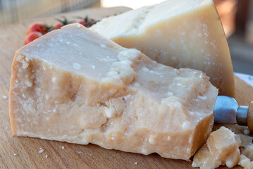 Traditional italian food - 36 months aged in caves Italian parmesan hard cheese from Parmigiano-Reggiano, Italy