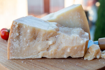 Traditional italian food - 36 months aged in caves Italian parmesan hard cheese from Parmigiano-Reggiano, Italy