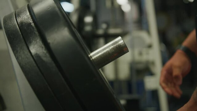 Old School Gym Workout: Bodybuilder Adding Weight Plates to Classic Strength Machine, Cinematic Moody B Roll Shot on RED in 4K