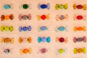 Colorful candies from murano glass. Multicolored glass candies, repeating pattern.