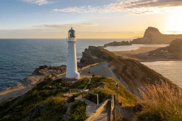 Foto op Aluminium A lighthouse on beautiful landscape at sunset, Castlepoint, New Zealand © Peter