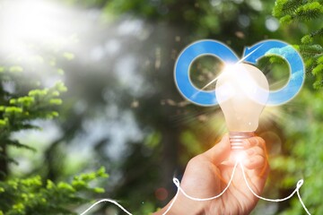 Circular economy concept. Hand with light bulb