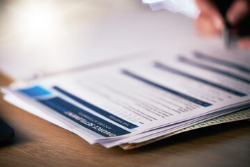 Person, hands and writing on divorce documents, application or information on table or office desk. Closeup of partner signing legal paperwork, marriage contract or filling form for agreement or deal