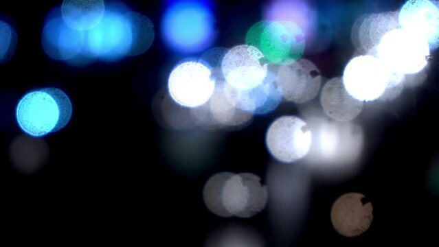 Headlights of moving cars and city lights in large bokeh,Blurring background car lights.Blured Night Traffic Car Lights on Busy Street bangladesh. Beautiful Bokeh Background. 4K.