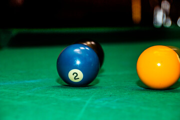 billiard balls on a green table close-up