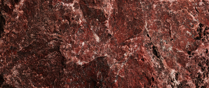 Stone texture abstract background. Close up natural red jasper mineral rock backdrop.