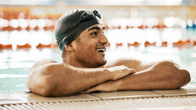 Happy, man and athlete in swimming pool water after training, workout or exercise for wellness, performance or fitness. Swimmer, relax or smile for sport, challenge or health in race competition - Powered by Adobe