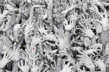 Abstract Sculpture of White Reaching Hands