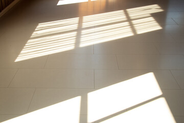 Shadow and light from a window on the floor of a house, sunlight and shadow