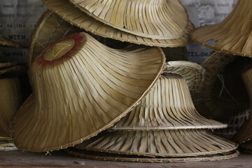 Thai Farmer's Hats in a Pile on a Table