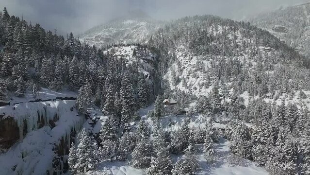Winter Wonderland from a Drone's Perspective towards majestic snow-covered mountains