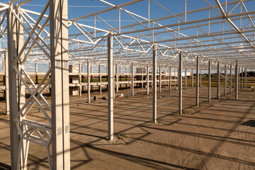 Drone photography of new warehouse metal frame and construction site under development