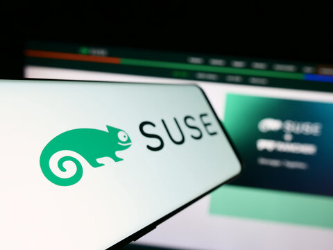 Stuttgart, Germany - 09-10-2023: Smartphone with logo of open-source software company SUSE S.A. on screen in front of business website. Focus on left of phone display.
