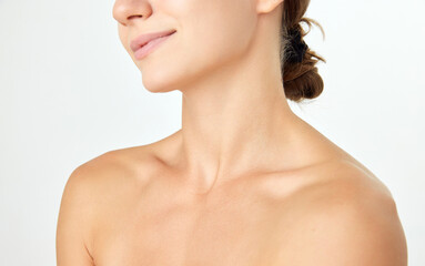 Cropped image of female body, bare shoulders isolated on white background. Moisturizing, soft skin....
