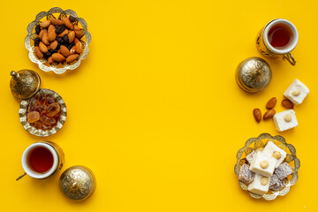 Arab style tea table with tea and sweets. Muslim holiday background