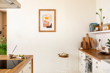Minimalist composition of kitchen interior with mock up poster frame, white kitchen furniture,...