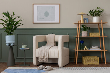 Stylish composition of cozy living room interior with mock up poster frame, beige armchair, wooden rack, slippers, vase with flowers, patterned rug and personal accessories. Home decor. Template.