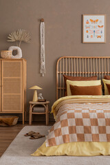 Aesthetic composition of cozy bedroom interior with mock up poster frame, stylish bed, chess board...