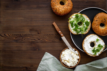 Fresh bagels with cheese cream. Homemade bread background