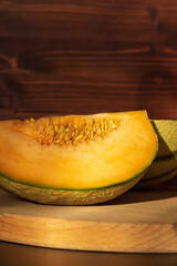 Cut yellow slices of ripe melon, close-up. A sweet delicious natural. Vertical photo