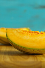 Melon close-up cut. Cooking food in the kitchen in summer. Vertical photo