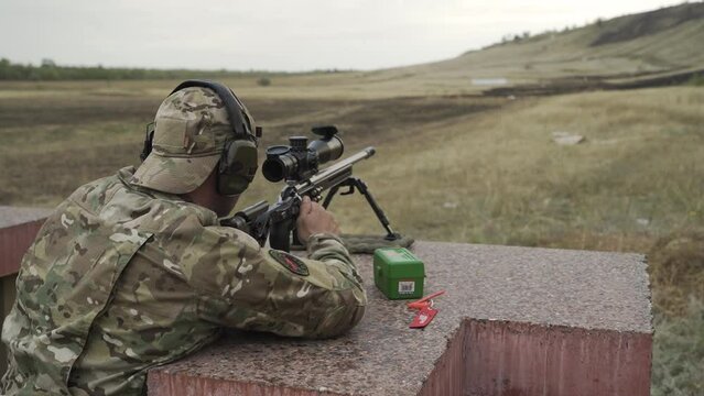 The shooter performs exercises on targets in a sitting position
