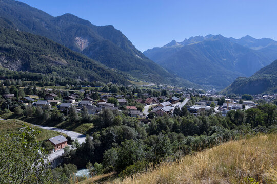 View looking towards Modane in the Maurienne Valley in the Auvergne-Rh&ocirc;ne-Alpes region in southeastern France. Scenic mountain French landscape in the Vanoise National Park with copy space.