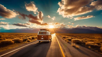 Poster A vintage van traveling, nomadic escape alone in nature at sunset, on a desert path for a road trip towards adventure and freedom © mozZz