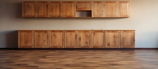 Wooden cabinets and flooring in empty kitchen