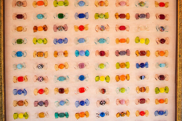 Colorful candies from murano glass. Multicolored glass candies, repeating pattern. - obrazy, fototapety, plakaty