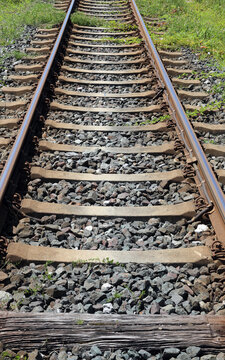 long iron train rail tracks to infinity with no people