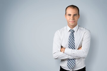 Happy young confident business man posing