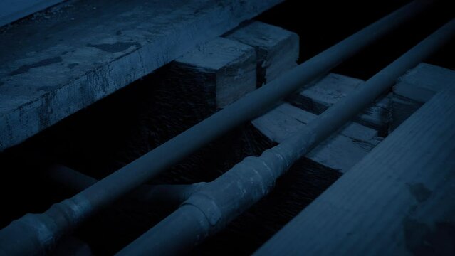 Exposed Water Pipes In The Dark
