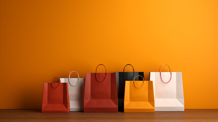 Colorful paper shopping bag on orange  background for copy space. retail shopping concept