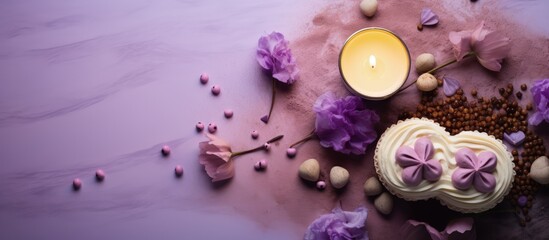 Obraz na płótnie Canvas Top down view of dalgona coffee adorned with foam hearts chocolate chips cookies candles and purple lilac flowers on a light table