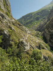 The mountains and hiking trails of the picos de europa in Spain. These bright landscape images during the summer of the Spanish mountainsides showcase the rocky and dry environment. Lush green trails.