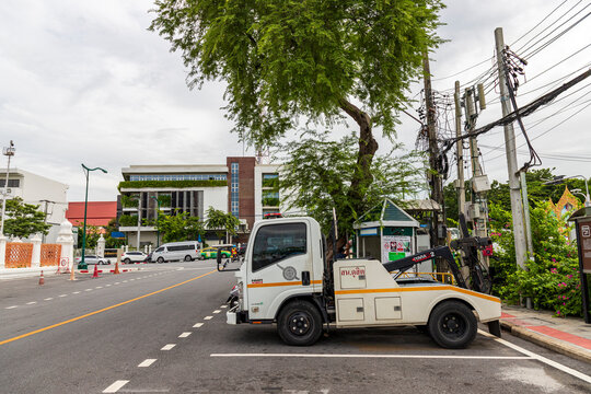 BANGKOK, THAILAND - SEP 12, 2023: Tow truck from Dusit Police Station was parked on the side of the road ready to perform duties when someone breaks traffic laws, such as parking in a prohibited area.
