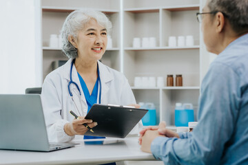 Asian female doctor and male patient talking health concept