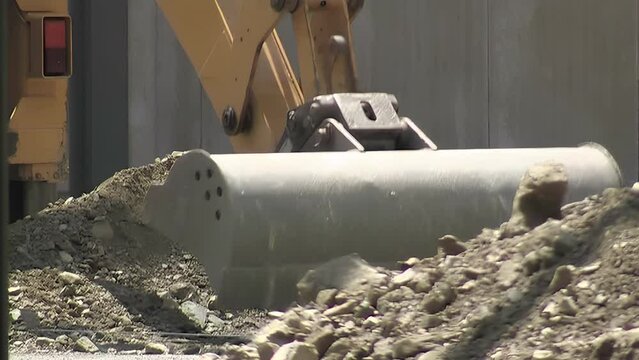 Excavator excavating the dirt in a construction site