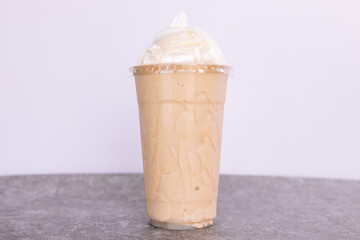Vanilla iced coffee with whipped cream