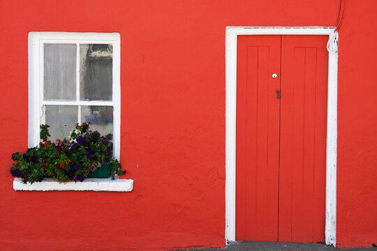 A Red Painted House With Flower Box In The Window; Eyeries, County Cork, Ireland