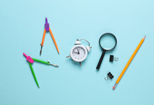 Set of school supplies on a blue background. Top idl