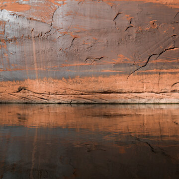 A Flat Rock Wall Against The Colorado River; Arizona, United States of America