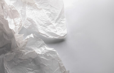 Wrinkled white wrapping paper on white background