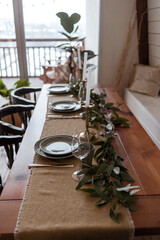 Table served for Wedding dinner in living room. Elegance dinner table and tableware. Cozy home