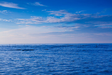 sea and sky,Calm sea and blue sky background. © banjongseal324